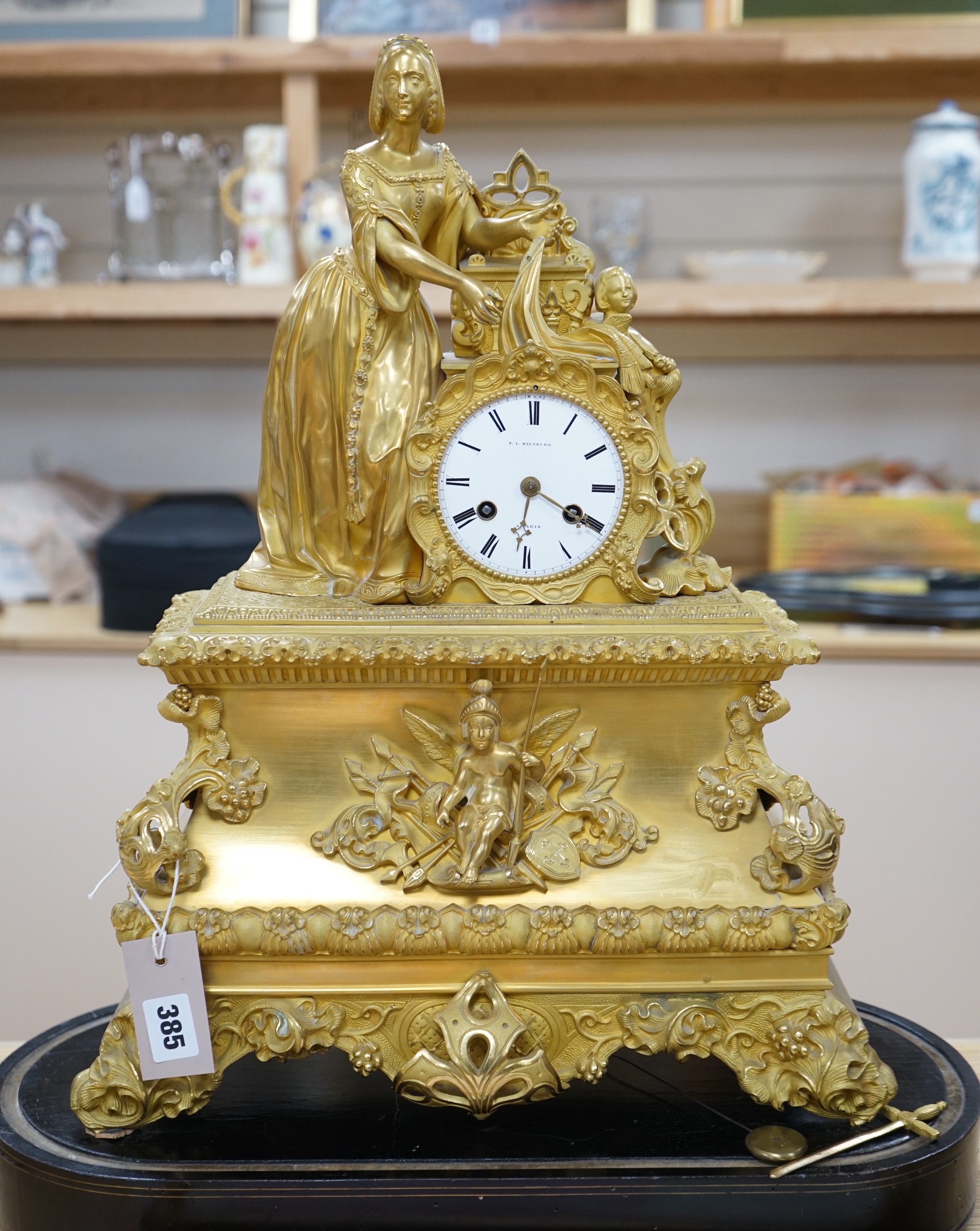 A 19th century ormolu figural French mantel clock on stand, by F.LHabsburg, Paris, 59cms high